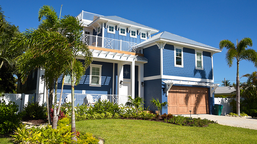 blue house with architectural details located in Florida