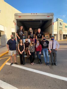 Cabernet Sleigh 2020 Volunteers posing in front of loaded truck