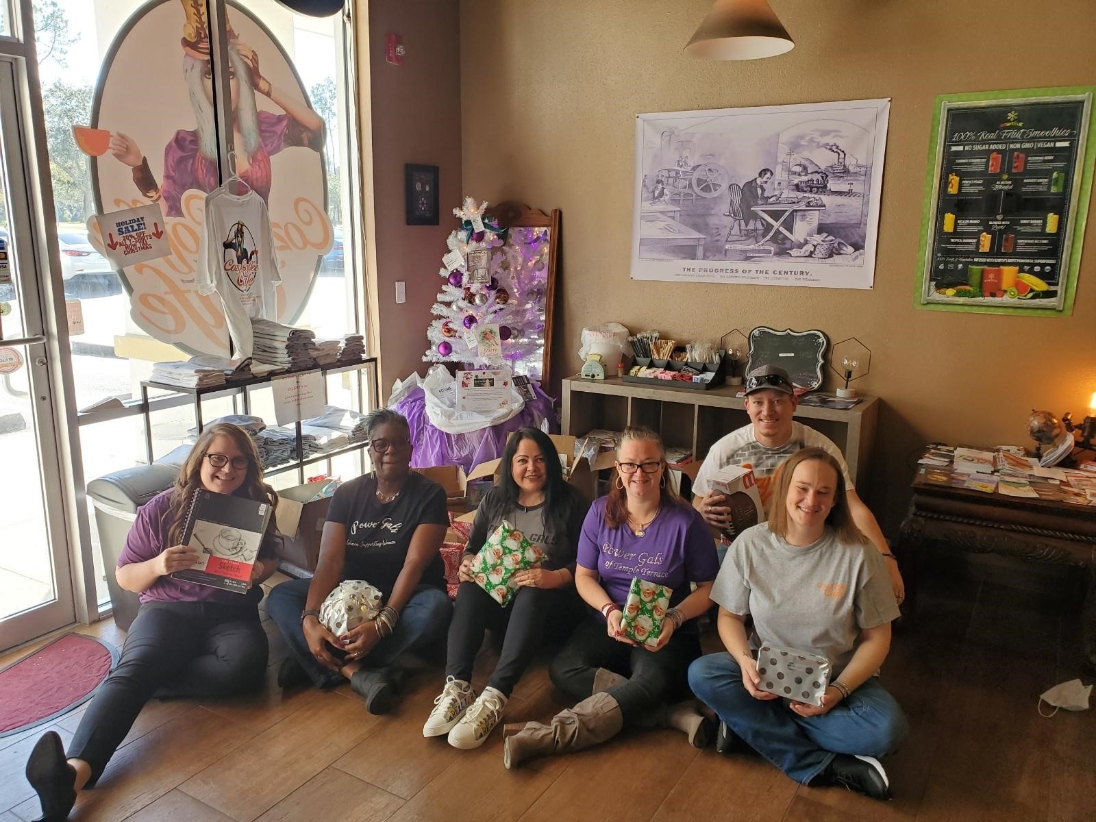 Cozy Coffee Cafe Employees posing for a picture in the cafe