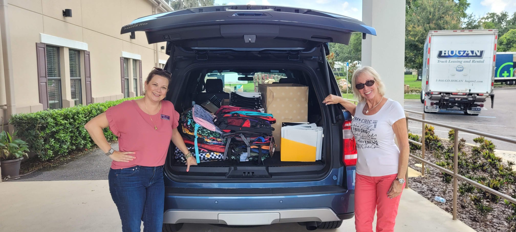 Real estate agents collecting school supplies for Backpacks of Hope